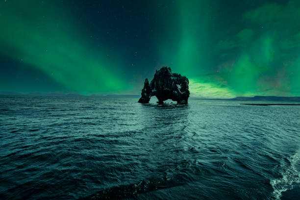 Hvitserkur landscape at night with beautiful Northern Lights. Iceland stock photo