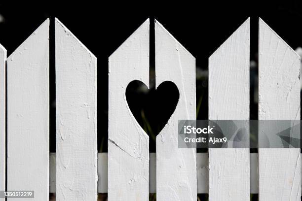 Heart Shape Cut Out Of White Suburban Residential Fence Stock Photo - Download Image Now