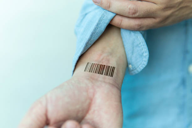 Bar code is on man hand. Clone of DNA and human genome. The concept digital electronic cards, tracking during the pandemic, in quarantine. Mass chipization of the world's population. Global control, Bar code is on a man hand. Clone of DNA and human genome. The concept digital electronic cards, tracking during the pandemic, in quarantine. Mass chipization of the world's population. Global control wrist tattoo stock pictures, royalty-free photos & images