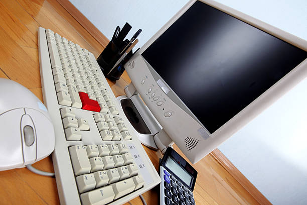 classic work place - keyboard and monitor at table