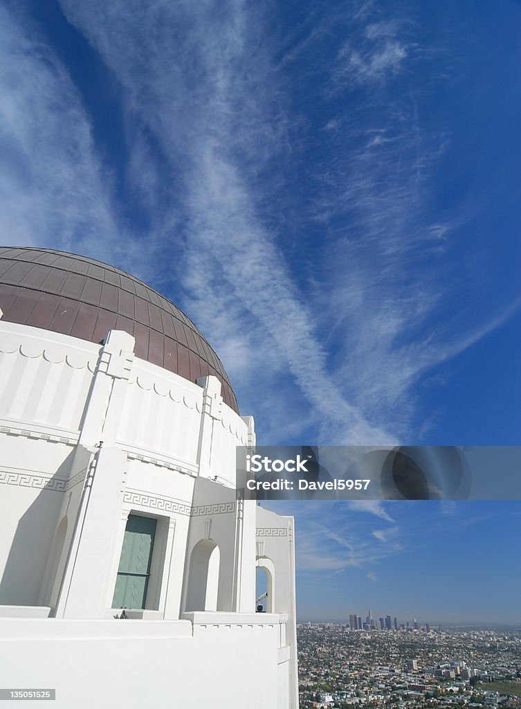 Griffith Park Observatory and skyline Griffith Park Observatory Planetarium with the Los Angeles skyline in the distance Aerial View Stock Photo