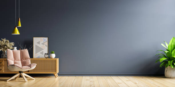 istock Mock up living room interior with armchair on empty dark blue wall wall background. 1350524791