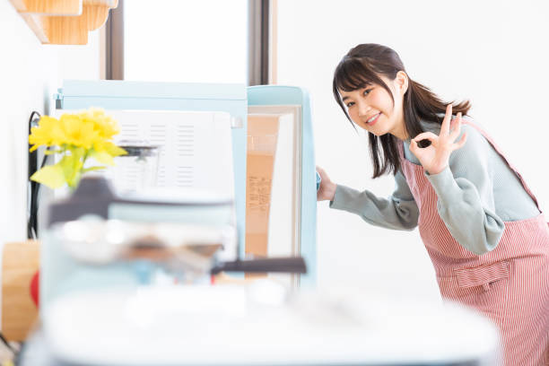 istock attractive asian woman cooks in a kitchen,Refrigerator 1350528297