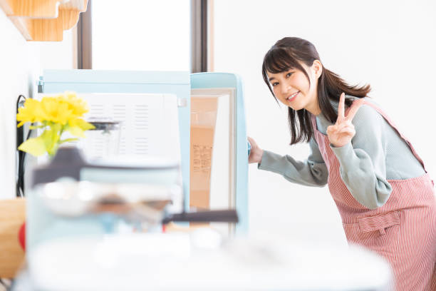 istock attractive asian woman cooks in a kitchen,Refrigerator 1350528319