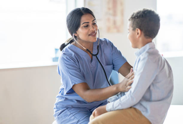 istock Nurse Listening to a Boys Heart 1350529986