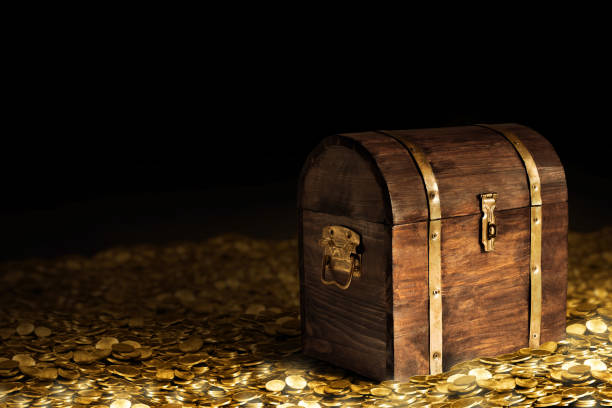 istock Wooden treasure chest on dark background 1350530000