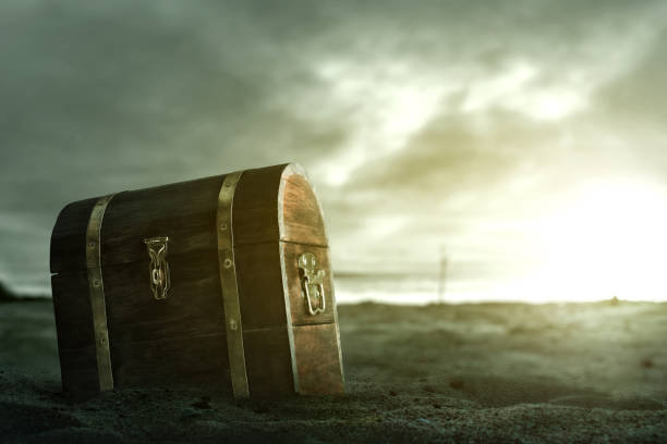 istock Wooden treasure chest on the beach 1350530002