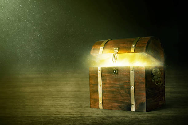 istock Wooden treasure chest on dark background 1350530003