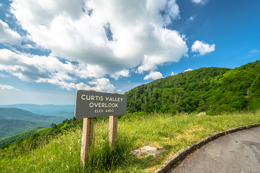 Scenic drive from Curtis Valley Overlook elevation 4460 ft. on Blue Ridge Parkway, Blue sky background with cloudy