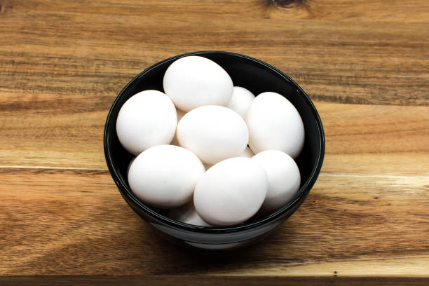 istock Fresh white eggs on cutting board prepare for cook 1350533868