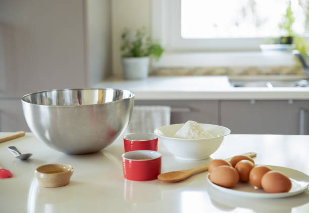 istock baking ingredients on white kitchen table, baking at home, cake in a mug preparation 1350541492