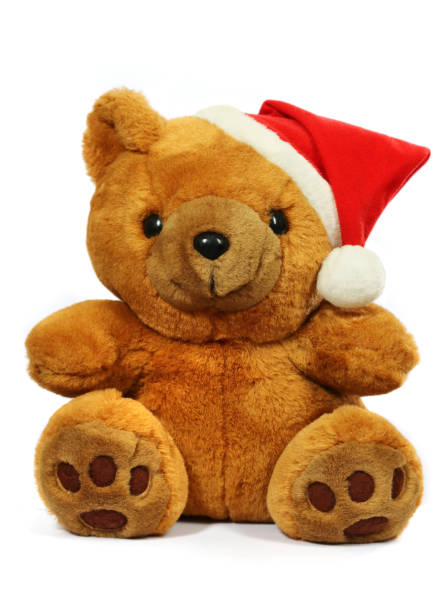 istock Teddy bear in a Christmas hat on a white background. 1350545650