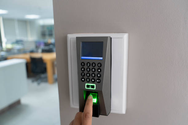 istock Businessman hand scanning finger on machine. 1350546571