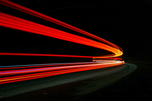 Truck light trails in tunnel. Long exposure photo taken in a tunnel