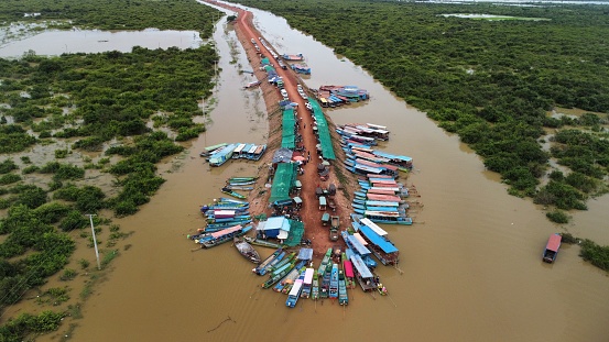 The Tonle Sap is Cambodia's biggest lake. This photo shows the entrance of the lake through one of its rivers, at the end of the road and at entrance of a floating village.