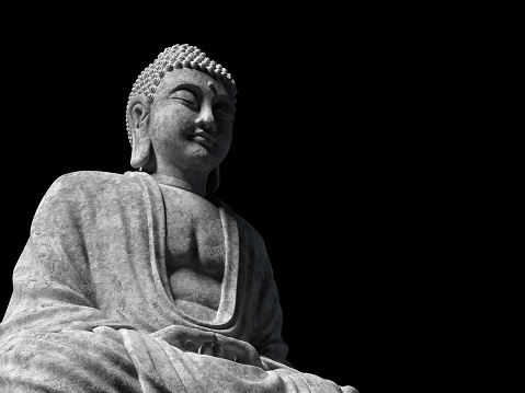 Statue of Buddha at peace on white background