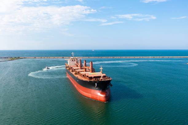 istock Aerial view of large bulk carrier approaching port. 1350552412