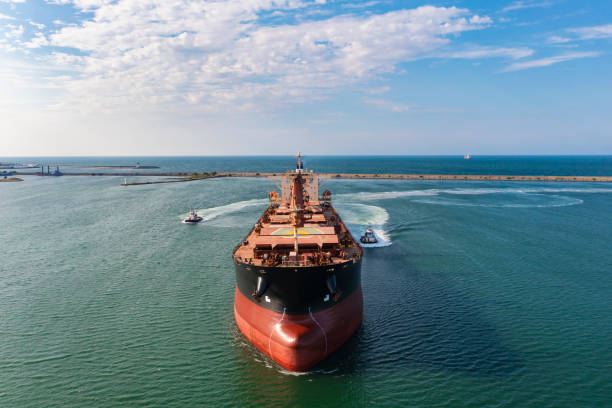 istock Aerial view of large bulk carrier approaching port. 1350552791