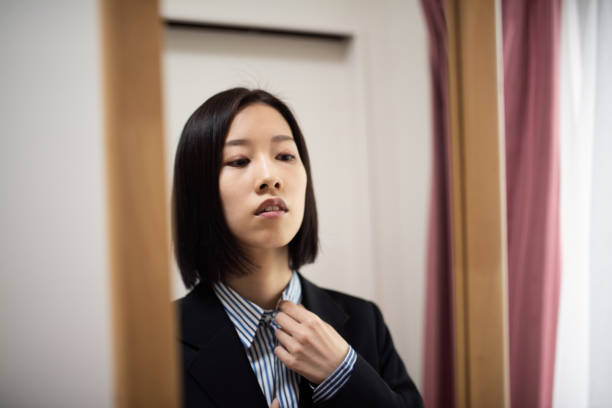 istock Confident businesswoman in mirror 1350555803