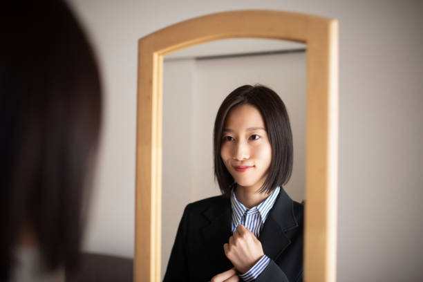 istock Confident businesswoman in mirror 1350555808