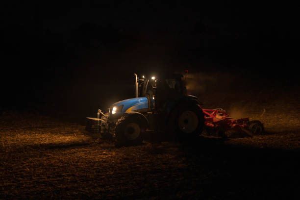 istock Tractor Working on Field in the Evening 1350557963
