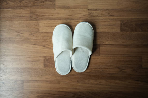 Pair of red slippers isolated on white background. Studio Shot.