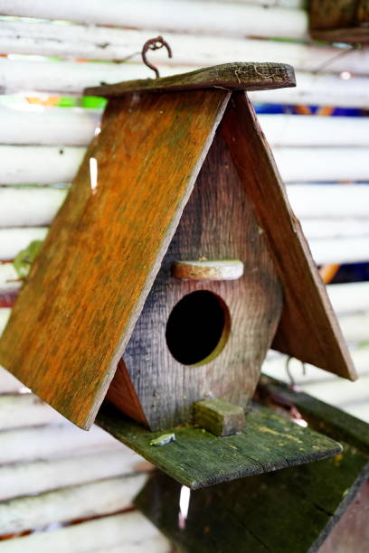 istock Bird Houses on a Stockade Fence 1350558271