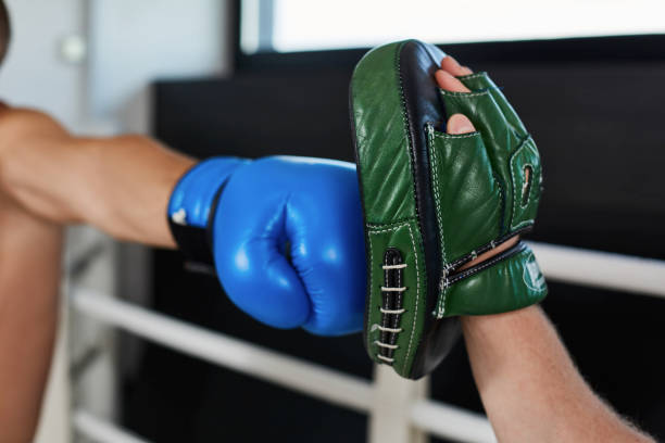 Hand of boxer and training gloves stock photo