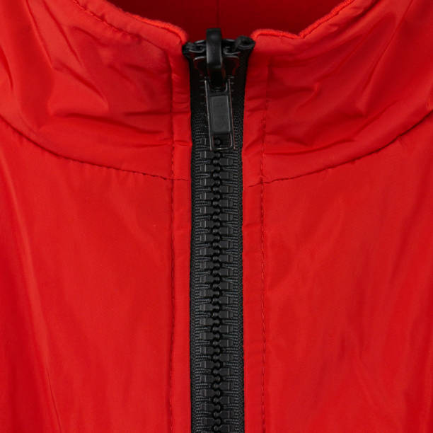 istock Collar - stand on a red nylon jacket with a black plastic zip 1350566405