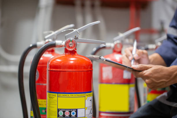 istock Engineer are checking and inspection a fire extinguishers tank in the fire control room for safety training and fire prevention. 1350567152