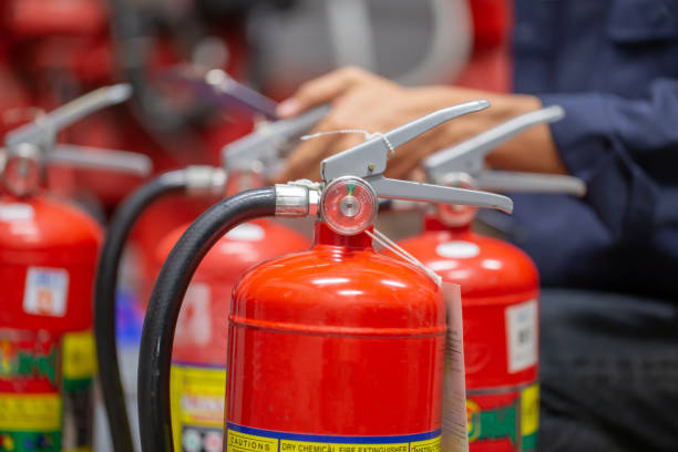 istock Engineer are checking and inspection a fire extinguishers tank in the fire control room for safety training and fire prevention. 1350567158