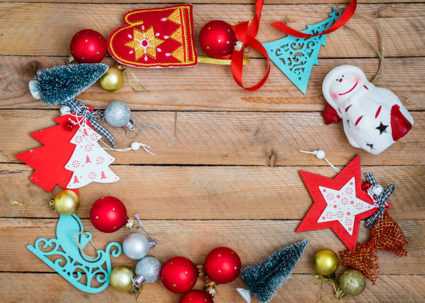istock Christmas decorations on wooden background with advertising space 1350571205