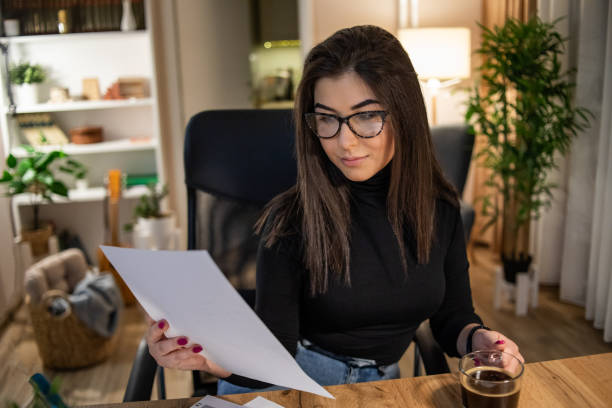 istock A young woman, a student, prepares for an exam and studies during the night 1350572846