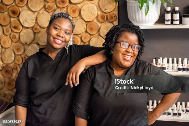 Portrait Of Two Beauty Stylists In Salon Stock Photo - Download Image Now - Hair Salon, Hairdresser, Black People