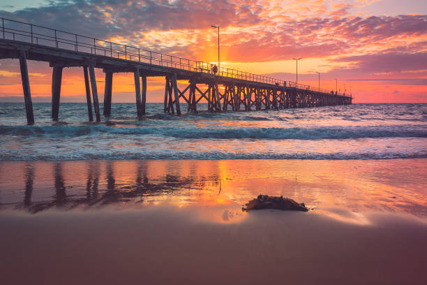 istock Port Noarlunga jetty with people during pink sunset 1350578074
