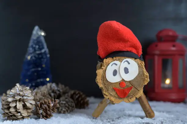 Photo of Caga tio de nadal, traditional handmade figure made with a wooden trunk. Christmas tradition in catalonia that brings gifts on Christmas Eve.