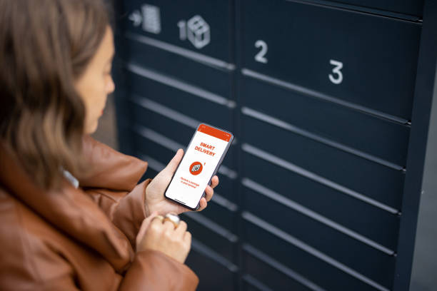 istock Woman showing smartphone with smart delivery app 1350579745