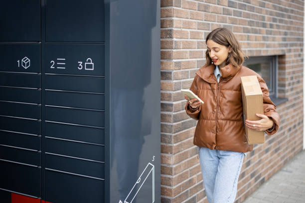 istock Caucasian woman with parcel near post terminal 1350579860