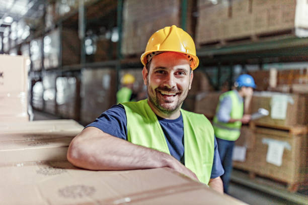 istock Happy manual worker in storage room. 1350581008