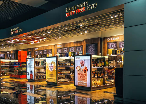 Alcoholic drinks shop in airport duty-free Kyiv, Ukraine - October 05, 2021: Alcohol store in the duty-free zone at the Igor Sikorsky Airport, Zhuliany, in Kyiv, Ukraine. Sale of expensive alcoholic beverages and luxury perfumes during travel and international flights contactless airport stock pictures, royalty-free photos & images