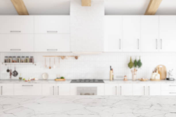 empty white marble surface with blurred kitchen background - dining table food elegance imagens e fotografias de stock