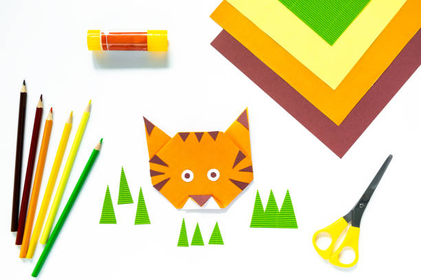istock Instruction step by step origami tiger. Children's craft 1350582115