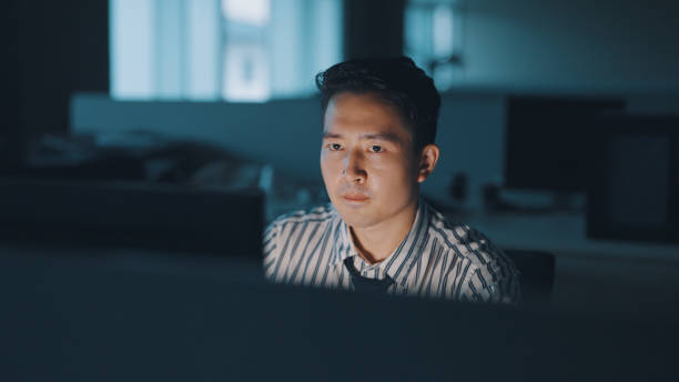istock Asian businessman work late at night 1350582609