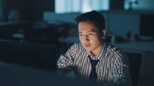 istock Asian businessman work late at night 1350582662