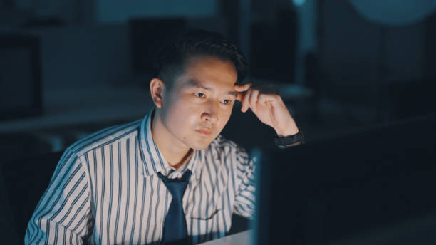 istock Asian businessman work late at night 1350582678
