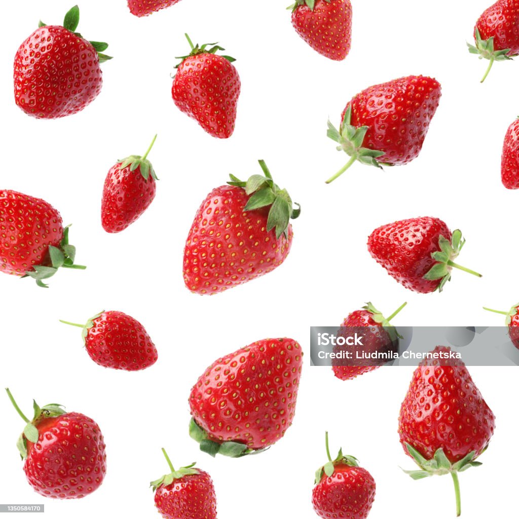 Set with ripe strawberries falling on white background Strawberry Stock Photo