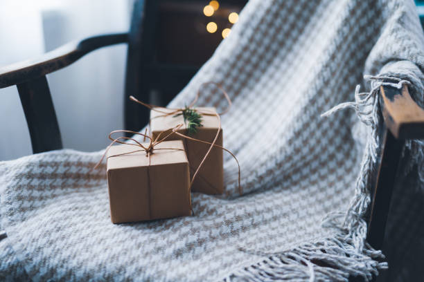 Boxes with a Christmas gift placed on a chair stock photo