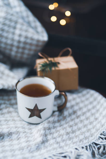Christmas decoration with cup of tea and giftbox stock photo