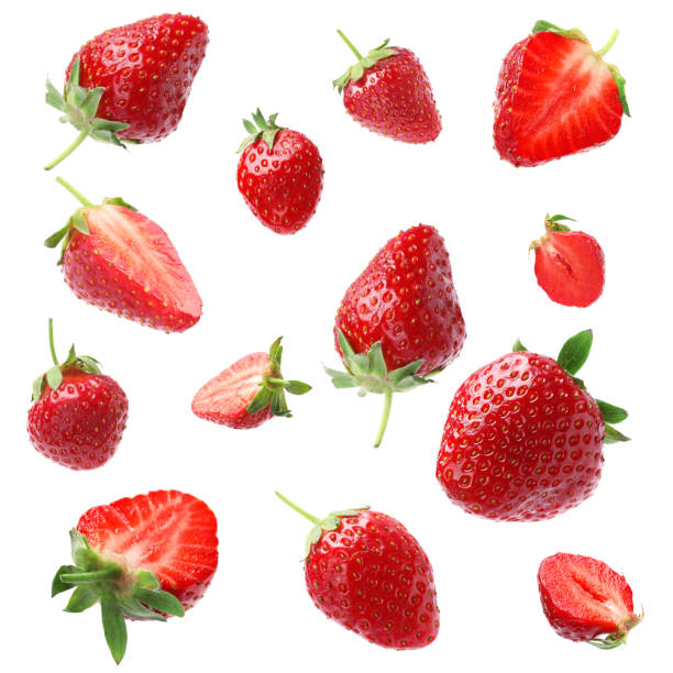 istock Set with ripe strawberries falling on white background 1350585632