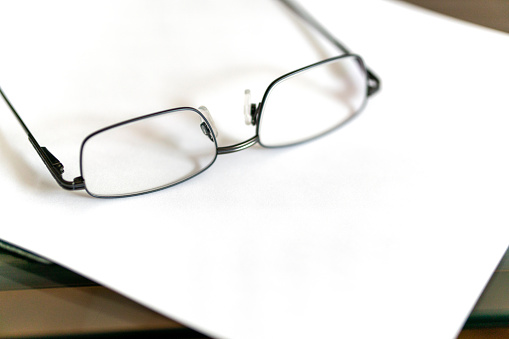 Glasses on blank document